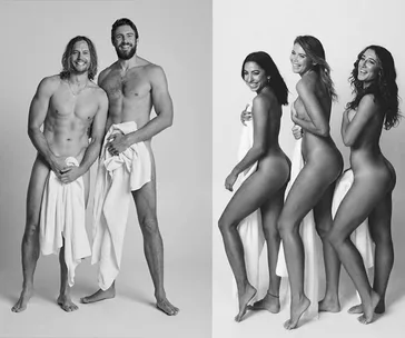 Two shirtless men and three women posing with towels, smiling, in a black and white photo.