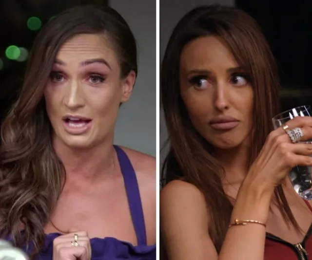 Two women from a reality show appear to be in a tense discussion, one speaking animatedly, the other looking surprised.