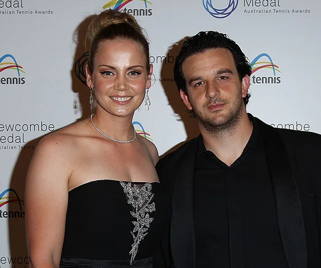 Two people dressed formally at an Australian Tennis Awards event, posing for a photo on the red carpet.