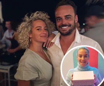 Couple posing happily at an event with inset showing woman holding a gift box.
