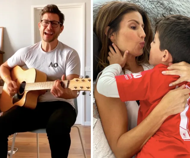 Man in glasses playing guitar next to woman embracing and kissing a young boy wearing a red sports shirt.