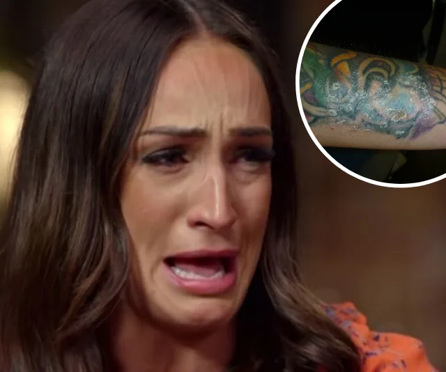 Woman crying with a distressed expression; inset shows psoriasis on a tattooed arm.