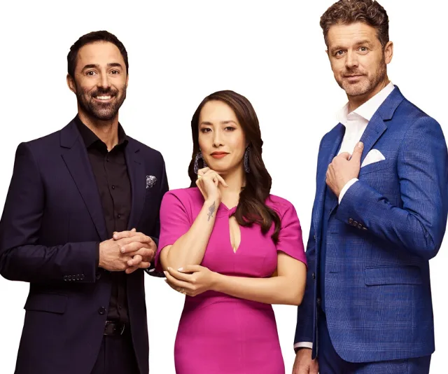 Three new MasterChef judges standing together: two men in suits and a woman in a pink dress.
