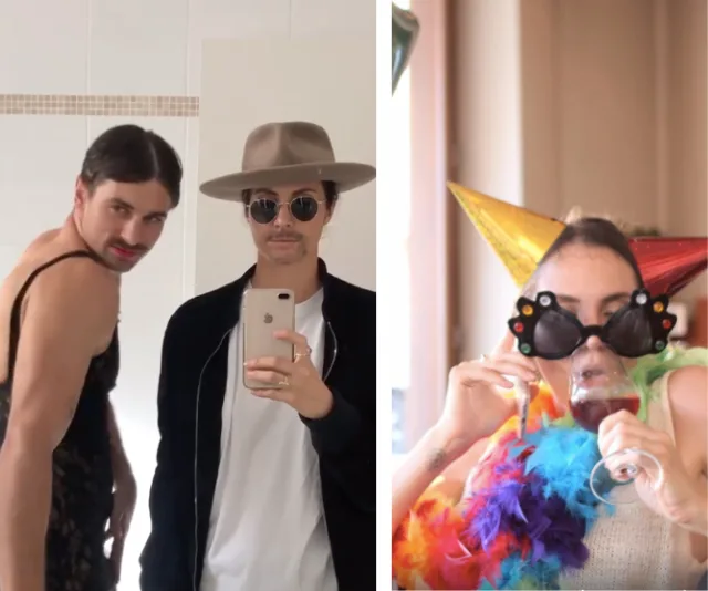 Men posing in front of a mirror, one in a dress, another in a hat; woman wearing party hat, glasses, and sipping wine.