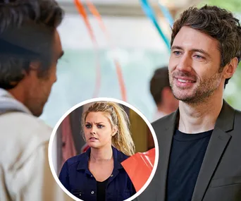 Two men conversing, one smiling. Inset shows a concerned blonde woman in a blue shirt.