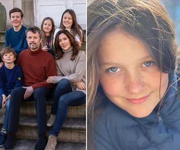 "Family portrait on steps; close-up of young girl with long hair and blue eyes smiling at the camera."