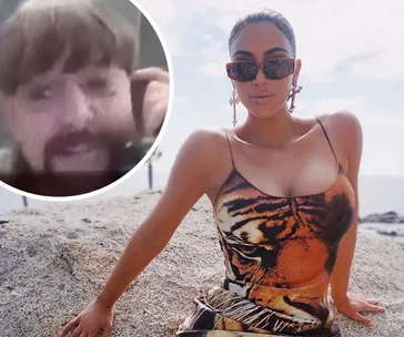 Woman in sunglasses and tiger print dress sits on rock; inset shows a person with a mustache in a video call.