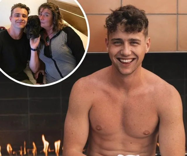 Shirtless man smiling by a fireplace, inset shows him with a woman and a dog.
