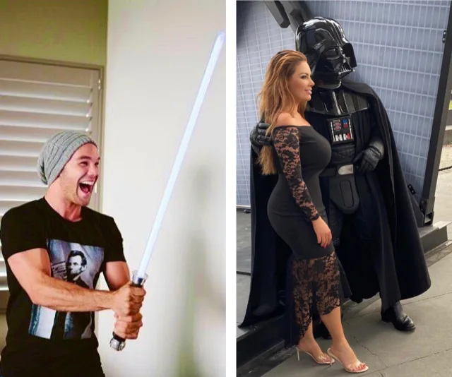 Two people: one holding a lightsaber; the other posing with Darth Vader.
