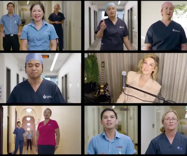 Nurses singing in hospital hallways; Delta Goodrem performs with guitar and microphone.