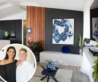 Living room with abstract painting and plants; inset of a smiling couple hugging.