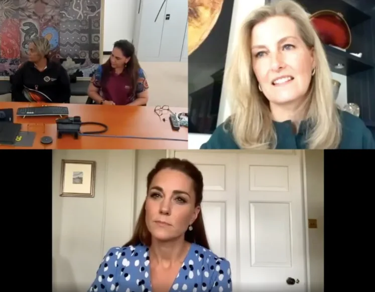 Group video call screenshot featuring four women, one in a blue polka dot dress, discussing healthcare.