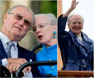 Danish queen talking to an elderly man; queen waving and smiling in a blue coat.