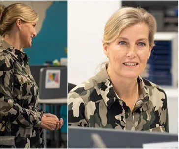 A woman in a camouflage dress smiling and engaged in conversation, with office background.