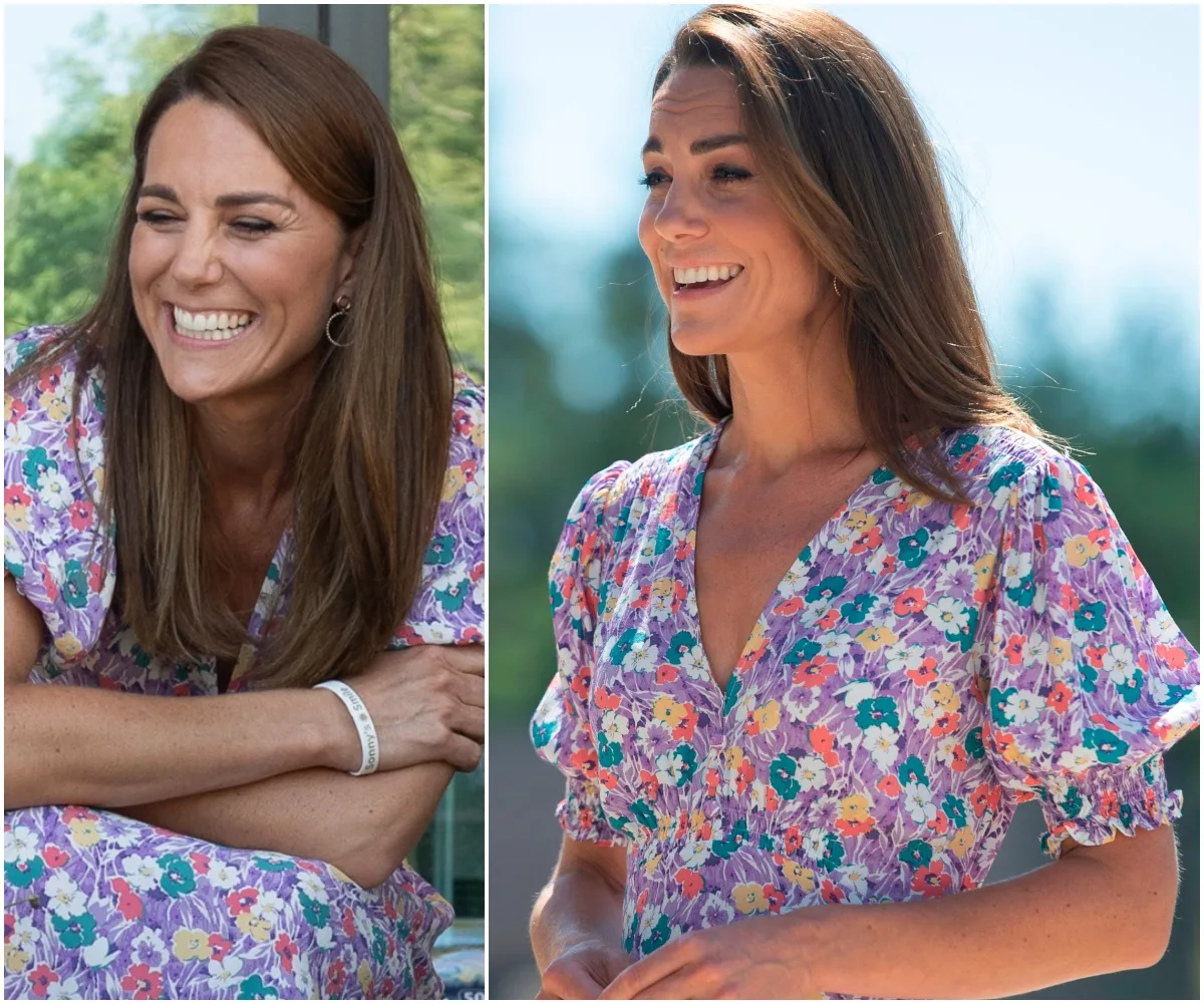 A woman in a floral puff-sleeve dress, smiling outdoors in sunlight.