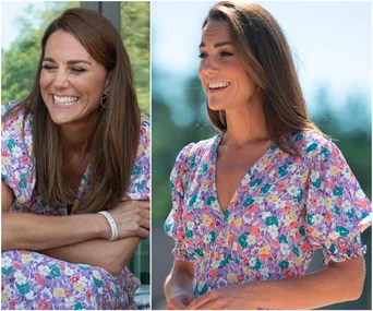 A woman in a floral puff-sleeve dress, smiling outdoors in sunlight.