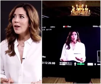 "Princess Mary in a white blouse speaking on camera, with studio lights and video screen in the background."