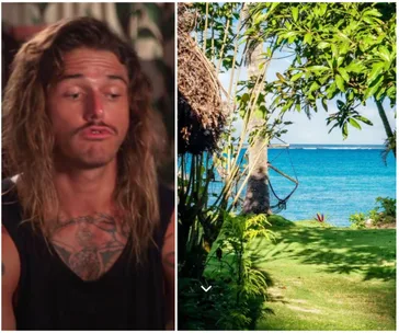 Man with long hair and tattoos, alongside a tropical beach setting with green foliage and ocean view.