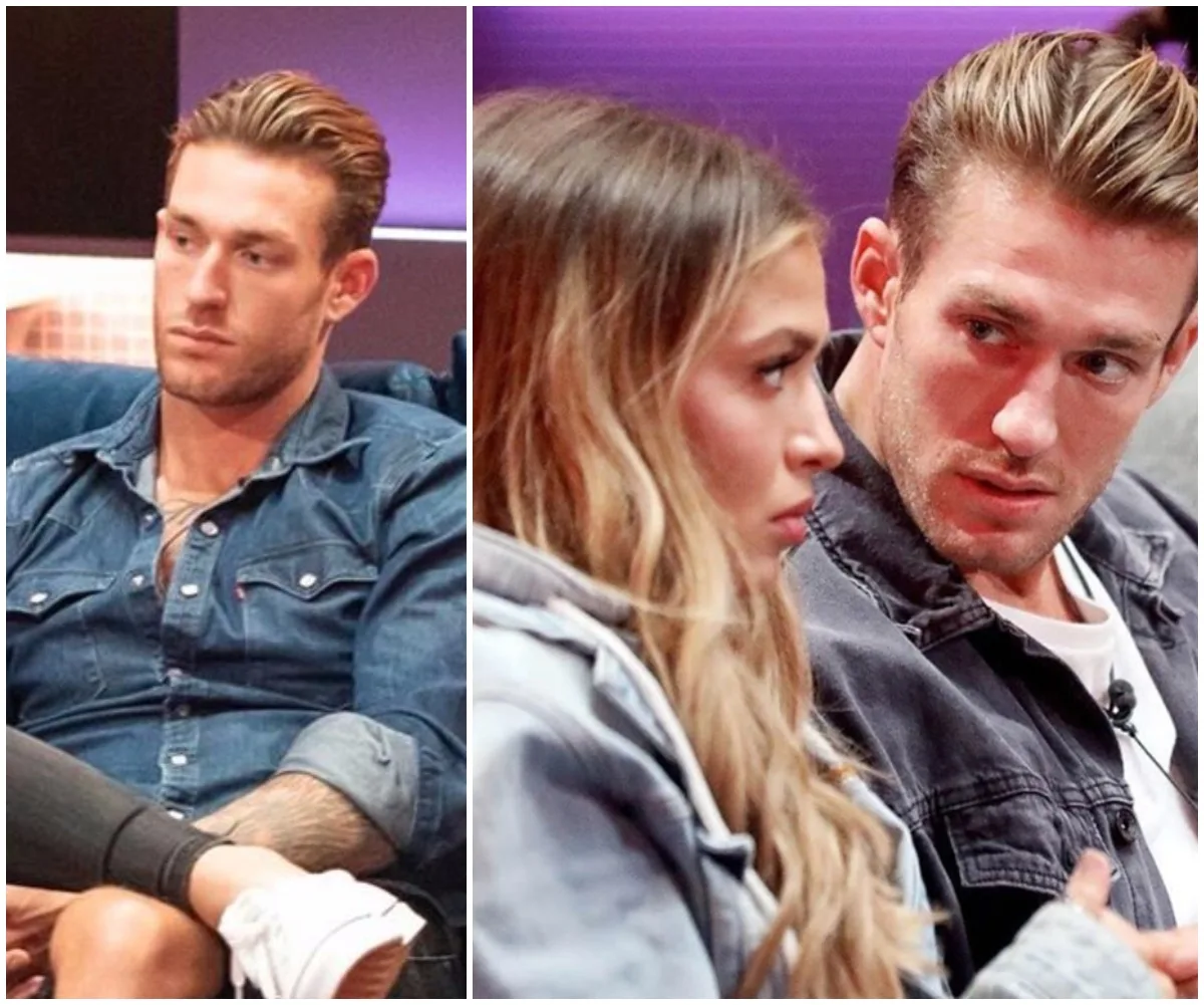 "Two individuals on a couch, one looking serious, the other engaging in conversation, in a reality TV setting."