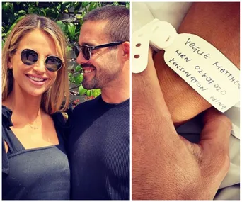 Couple smiling with sunglasses; baby wristband labeled "Vogue Matthews" visible on the right.