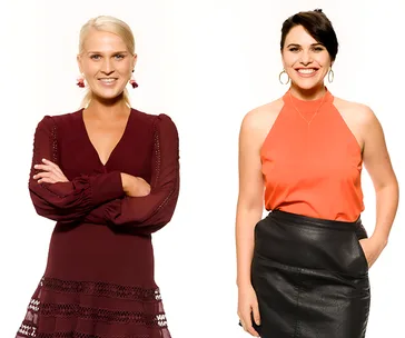 Two women smiling; one in a burgundy dress, the other in an orange top and leather skirt, against a white background.