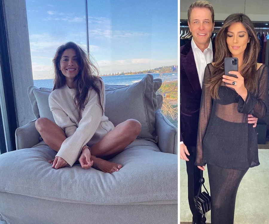 Person on a sofa with ocean view; two people posing for a mirror selfie, one holding a phone, dressed in evening attire.