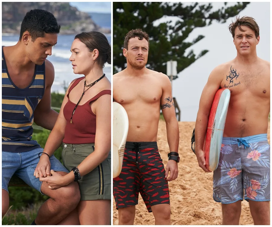 Couple holding hands and two men with surfboards on a beach in "Home and Away" scene.