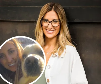 Woman smiling with glasses, long hair, wearing white top. Inset shows woman with a golden retriever.