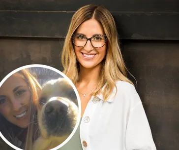 Woman smiling with glasses, long hair, wearing white top. Inset shows woman with a golden retriever.