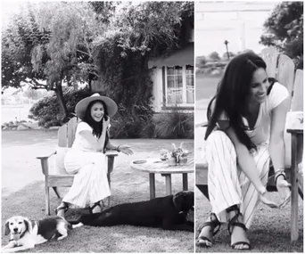 Meghan Markle sitting outdoors with two dogs, smiling and wearing a hat, surrounded by trees and flowers.