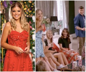 A woman in a red dress stands smiling; group of people laughing and talking in a cozy living room setting.