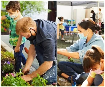 Prince Harry and Meghan Markle planting flowers with children, wearing masks, during a community activity.