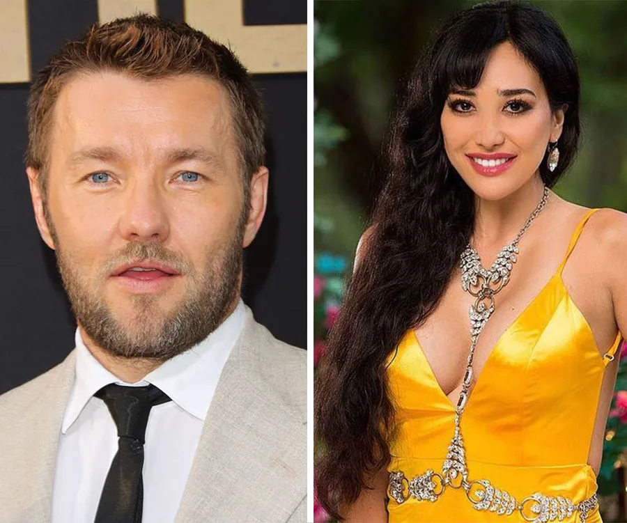 Two people side by side; one in a suit, the other in a yellow dress with ornate jewelry.