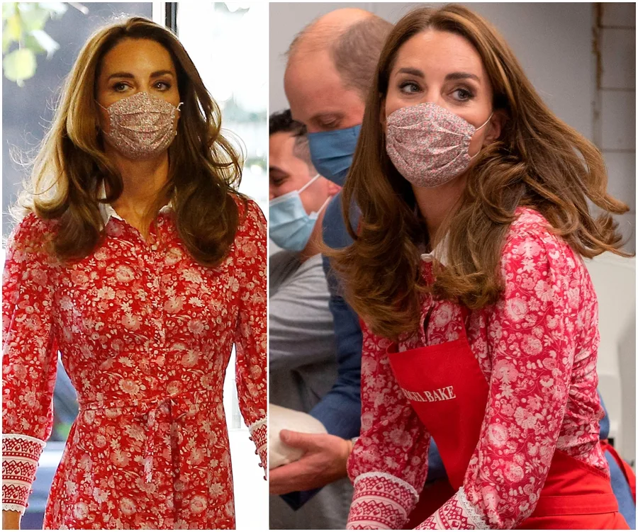 Kate Middleton in a floral red dress and face mask, engaged in a public event.