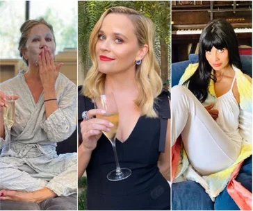 Women in various outfits hold champagne glasses; one wears a face mask, one in black dress, another in white attire on sofa.