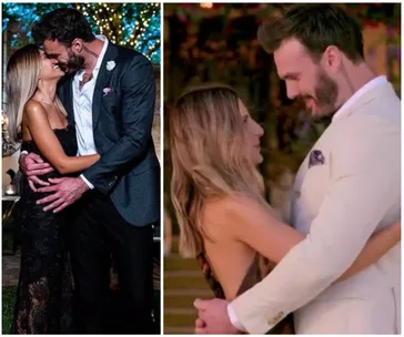 A couple embraces and smiles at each other under festive lights and in an elegant setting.