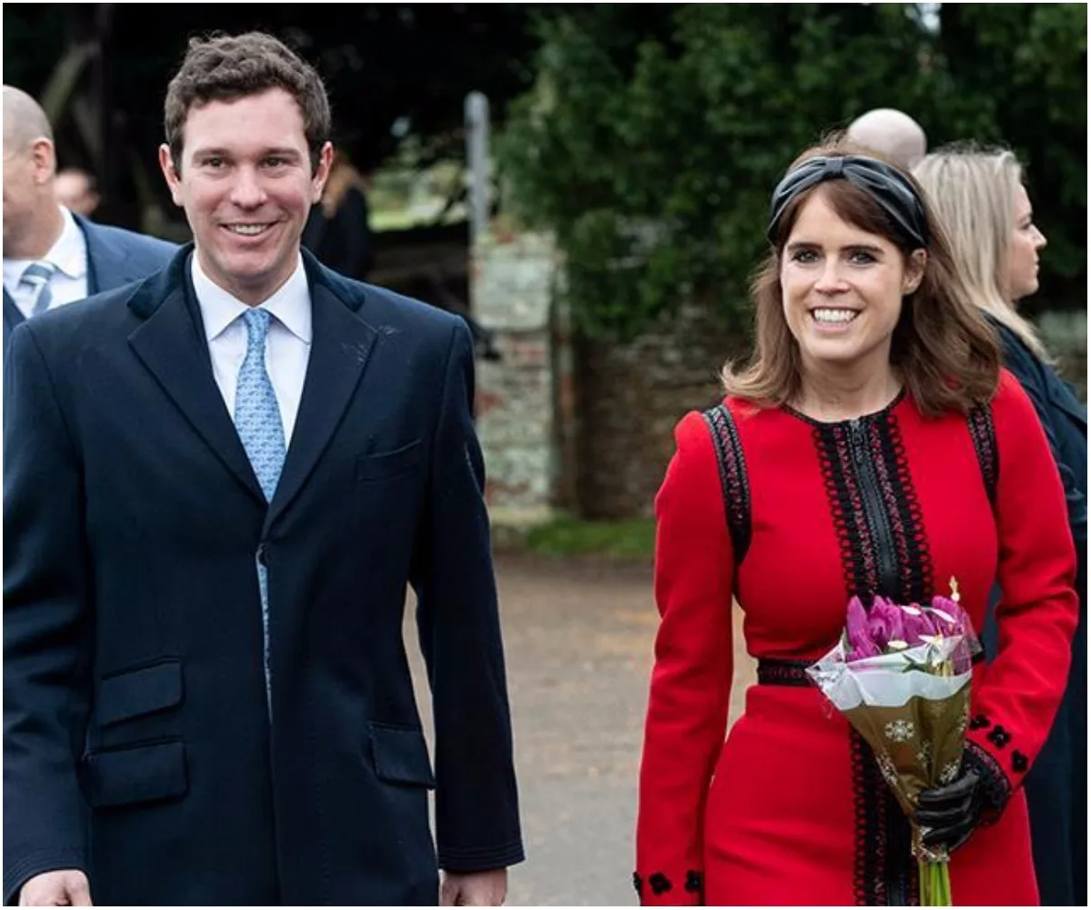 A smiling woman in a red dress holding flowers, accompanied by a man in a suit, outdoors.