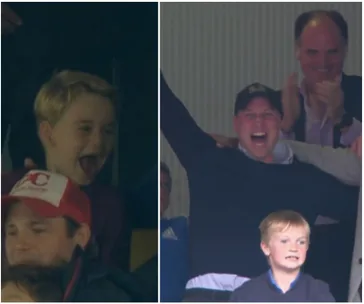 A group of people, including a child and an adult, cheer enthusiastically in a sports stadium.