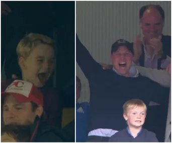 A group of people, including a child and an adult, cheer enthusiastically in a sports stadium.