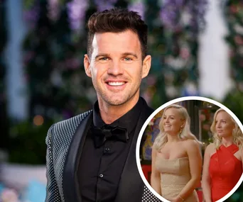 A man in a black tuxedo smiles in front of a blurred floral background; inset shows two women in elegant dresses.
