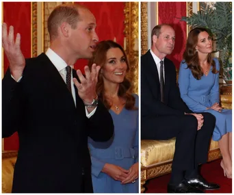Prince and Duchess at an event in a formal setting; Duchess wears a blue dress with a belt.