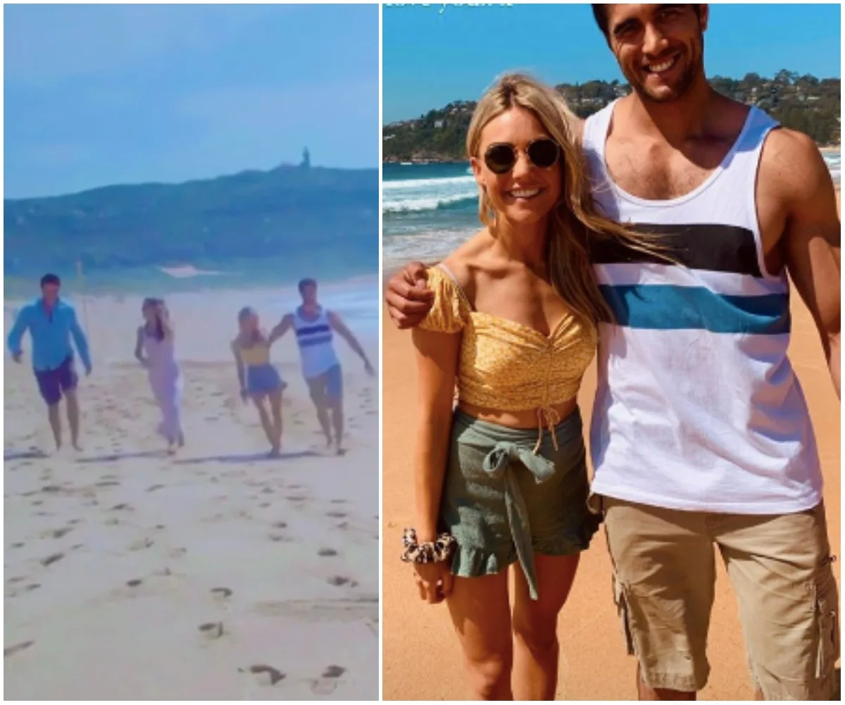 Group of four people walking on beach; woman and man posing, smiling near ocean.