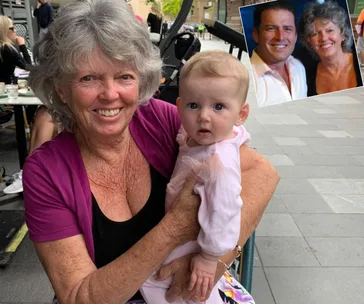 Older woman smiling, holding a baby in pink outside; inset photo of a man and woman smiling together.