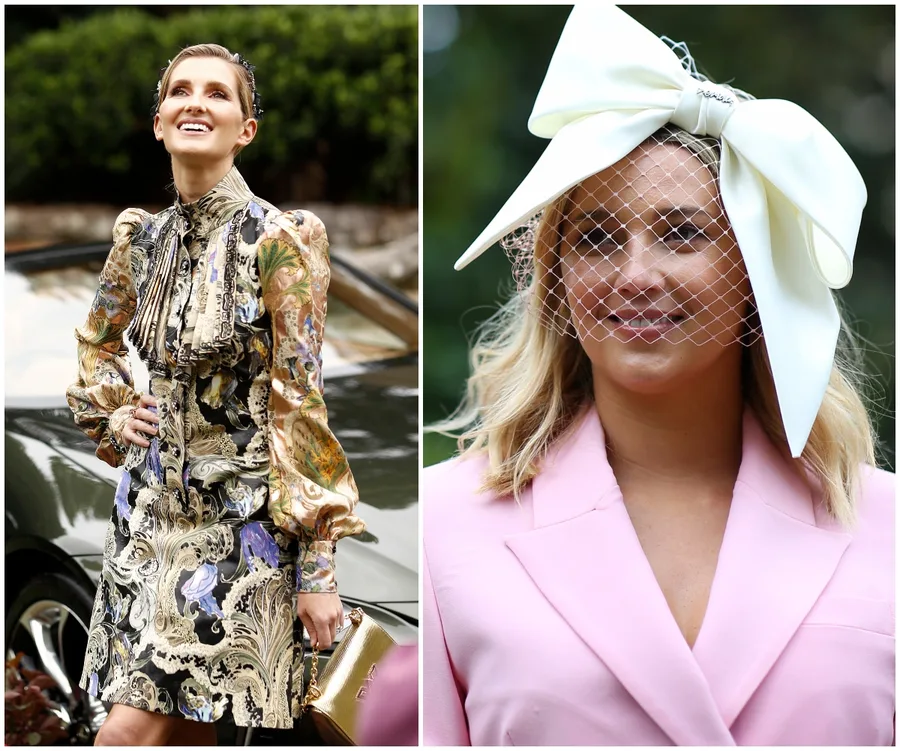 Two women in stylish racing outfits; one in a patterned dress, the other in a pink suit with white bow headpiece.