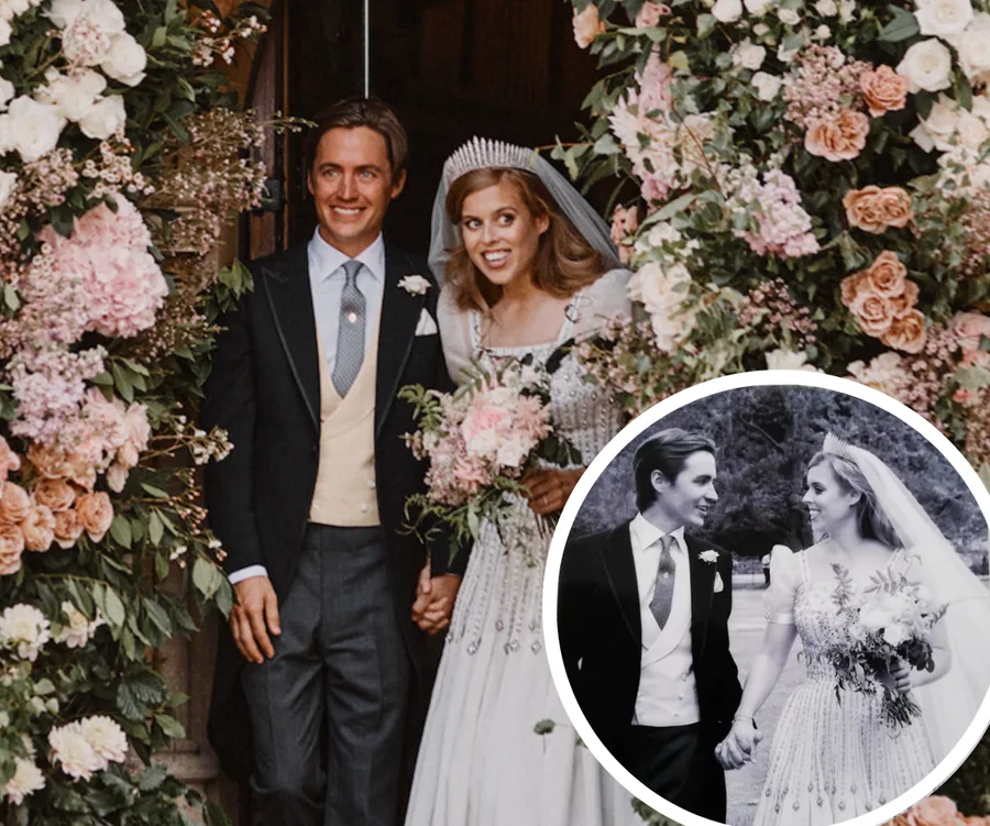 Princess Beatrice and Edoardo smiling in wedding attire, surrounded by floral arch.