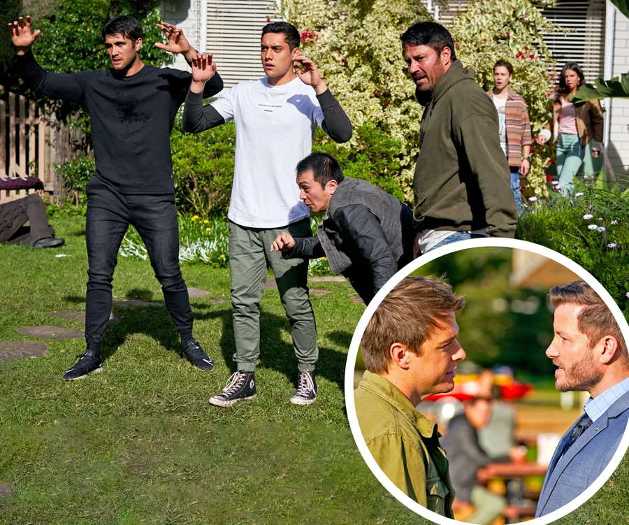 A tense backyard scene with several men in confrontation, one crouching, inset shows two men facing each other closely.