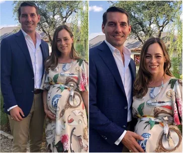 Prince Nicholas of Romania and his pregnant wife pose together outdoors, both smiling under a clear sky.