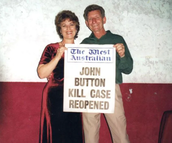 A smiling man and woman holding a newspaper headline: "John Button Kill Case Reopened" from The West Australian.