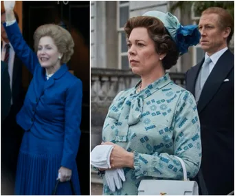 Two women in period costumes; one waves in a blue suit, the other stands in a patterned green dress with a handbag.