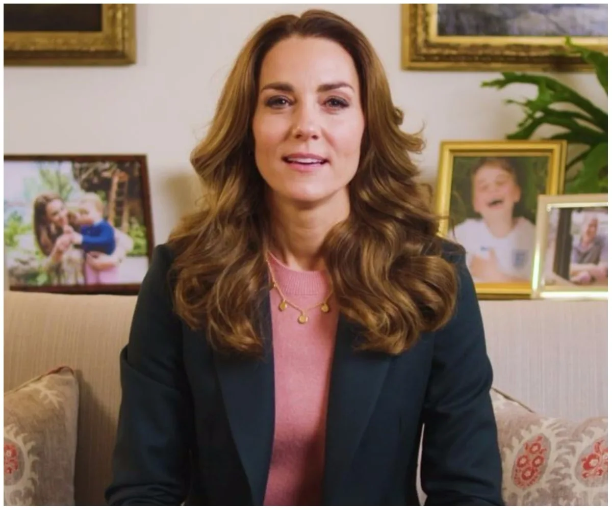 Kate Middleton delivering a video message, seated on a sofa with family photos in the background.